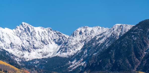 vail summer photo of the Gore Range with snow on it.